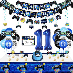Video game-themed party decorations with birthday banner, balloons, and controller for boys